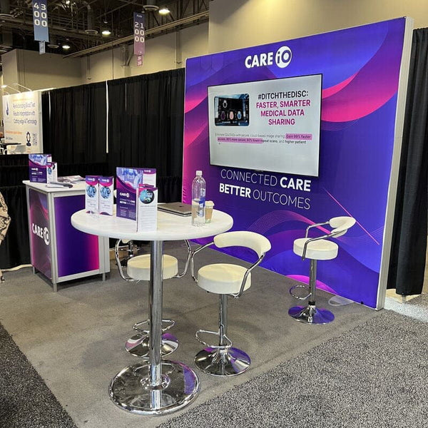 White leather bar stools with chrome frames and circular footrests
