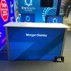 Blue diagonal-striped XRC9 backlit storage counter with Morgan Stanley branding