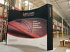 Our 10ft Curved Pop Up Fabric Display Table Kit includes a 6ft or 8ft fitted style cover to match your and black nylon