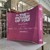 Our 10ft Curved Pop Up Fabric Display Podium Kit includes a hard shipping case with wheels that can be used as podium