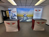 White and red SEG lightbox display tables with global aerospace branding