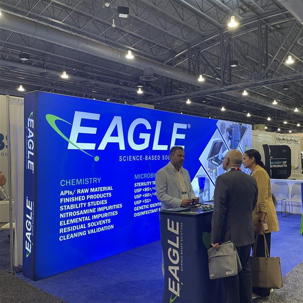 Blue Eagle brand booth in 20ft Backlit SEG Light Box Wall