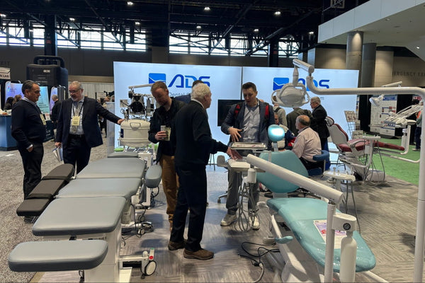 Light blue dental chair with white metal frame in 20ft frameless SEG lightbox