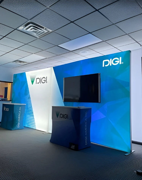 20ft Frameless SEG Lightbox with blue white geometric backdrop and flat-screen