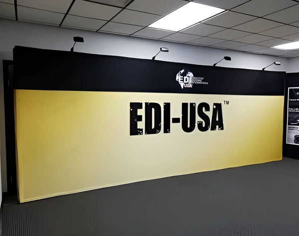 Yellow and black edi-usa branded backdrop on 20ft straight pop up fabric display