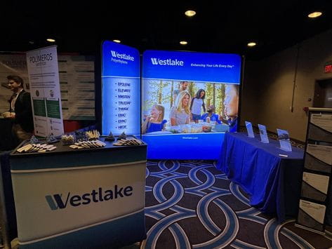 Blue Westlake 3ft backlit tension fabric display with screens and stands