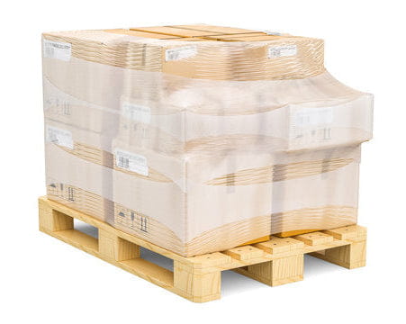 Stacked 48x48 wood pallets with shrink-wrapped cardboard boxes