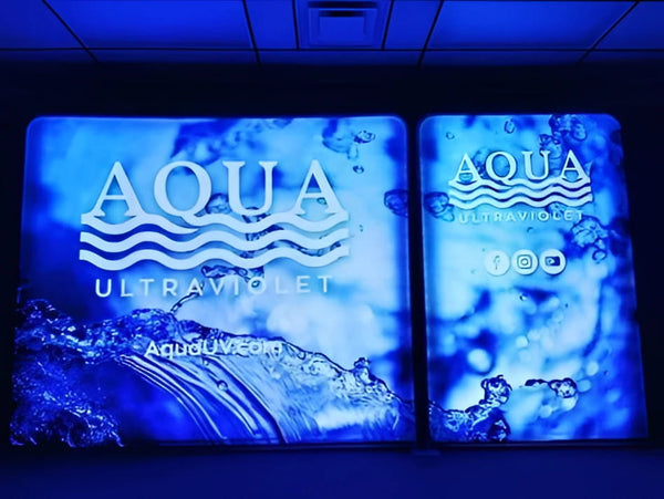 Blue Aqua Ultraviolet logo on 5ft backlit tension fabric display