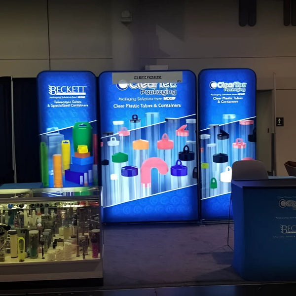 Blue 5ft Backlit Tension Fabric Display with Colorful Caps and Containers