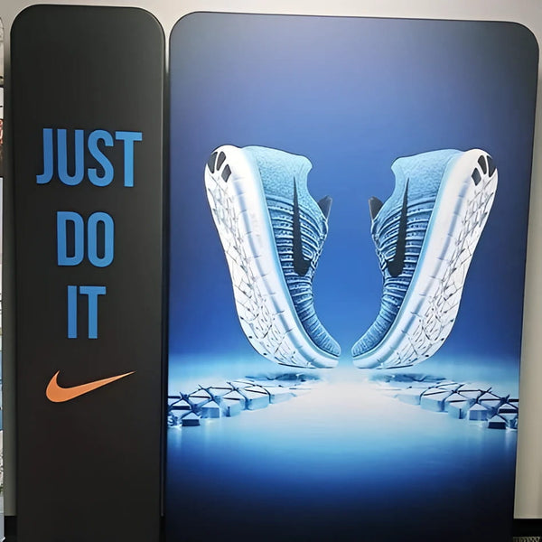 Blue and white Nike running shoes with textured upper on 5ft banner stand