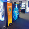 Blue and orange 6.5ft frameless SEG lightbox half wall display for Automated Medical Products Corp