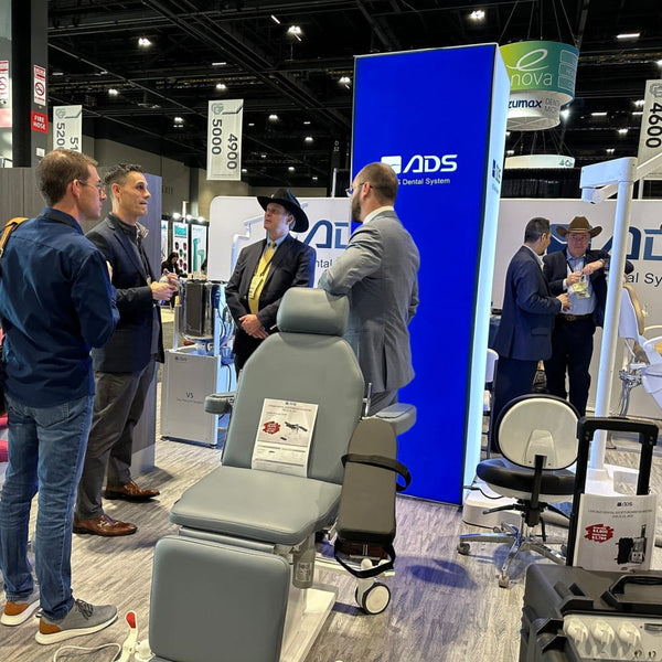 Gray adjustable dental chair in modern 8ft backlit SEG light box tower