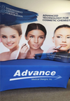 Our 8ft Curved Tabletop Tension Fabric Display Kit includes a custom printed fitted table cover to match