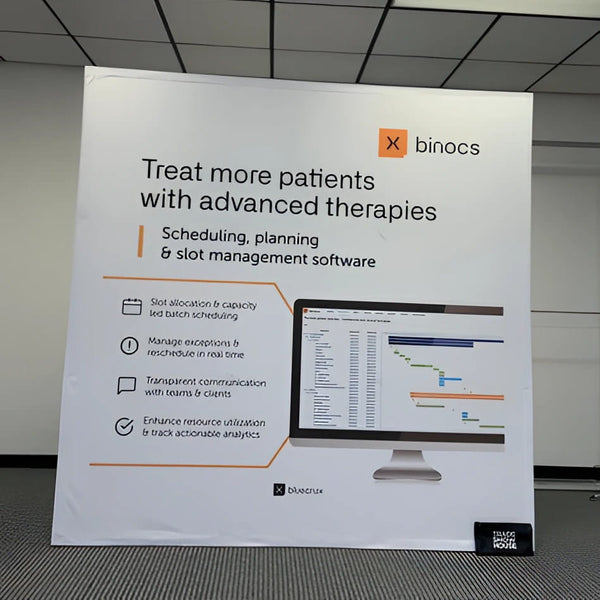 White Binocs scheduling banner on 8ft straight pop up fabric display table kit