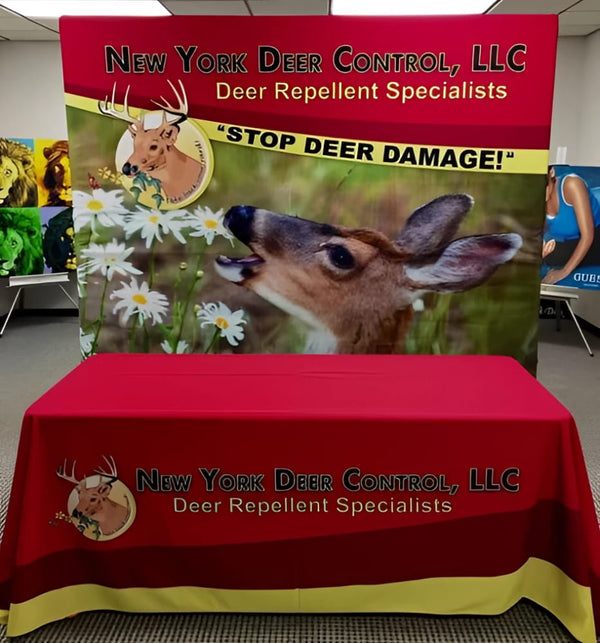 Red tablecloth with yellow trim and New York Deer Control LLC logo for 8ft straight tension fabric display kit