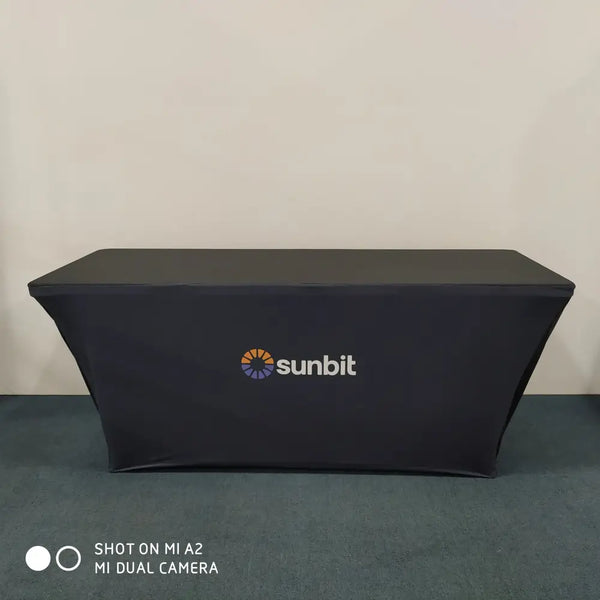 Black Sunbit logo on orange purple emblem backlit stretch table cover