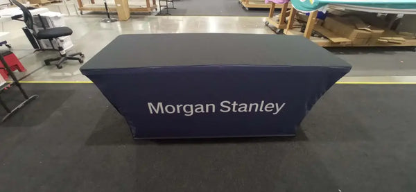 Navy blue backlit stretch table cover with Morgan Stanley logo