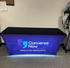 Backlit stretch table cover with Converse Now black and blue banner