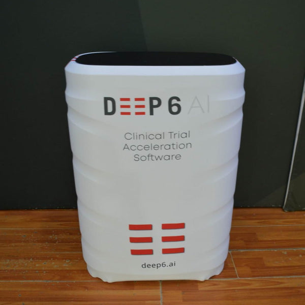 White cylindrical Deep6 AI display stand in C900 hard shipping case