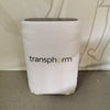 C900 Hard Shipping Case with Wheels: white fabric-covered rectangular appliance with dark gray top and Transphorm logo