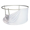 Circular metal frame with white fabric.