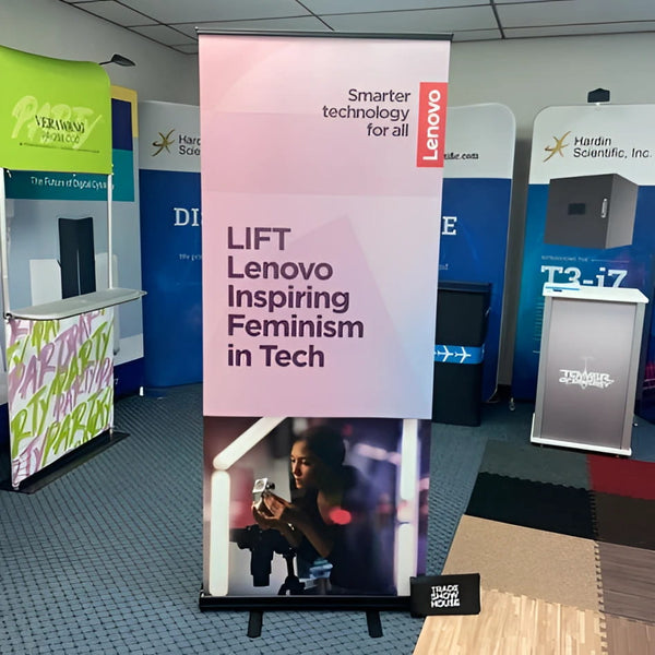 Pink Lenovo banner with black text and woman holding camera