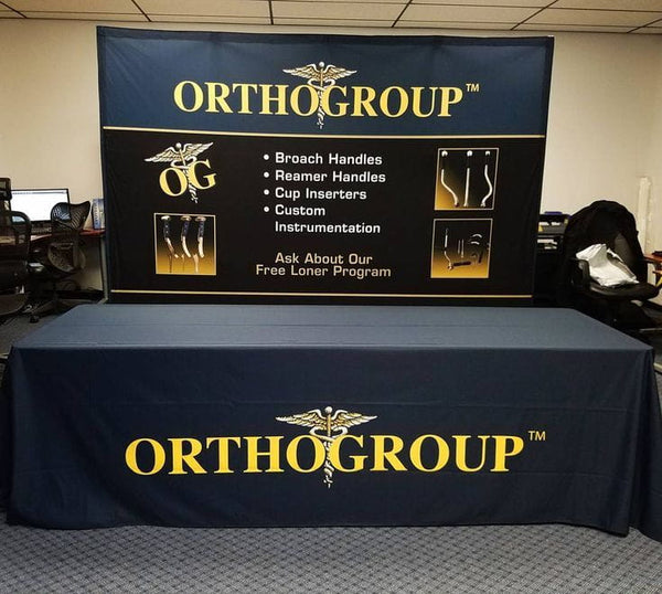 Our premium dye-sublimated, custom printed drape table covers are the perfect complementary tabletop display accessory