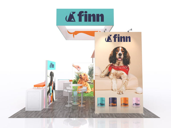 Brown and white spaniel in red bandana sits on beige couch for Finn brand ecoSmart ad