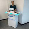 White Genesis BPS podium with blue LED edge lighting on Halo RGB LED Counter Top