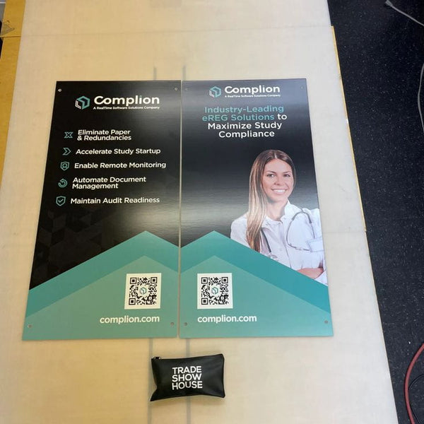 Black fabric trade show pouch with white text in Mounted Poster Signs