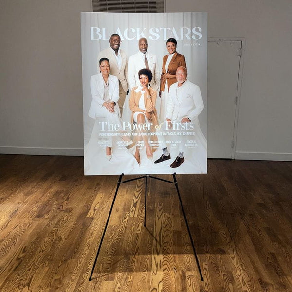 Large white Black Stars Magazine poster with six elegantly dressed individuals in formal attire, mounted sign