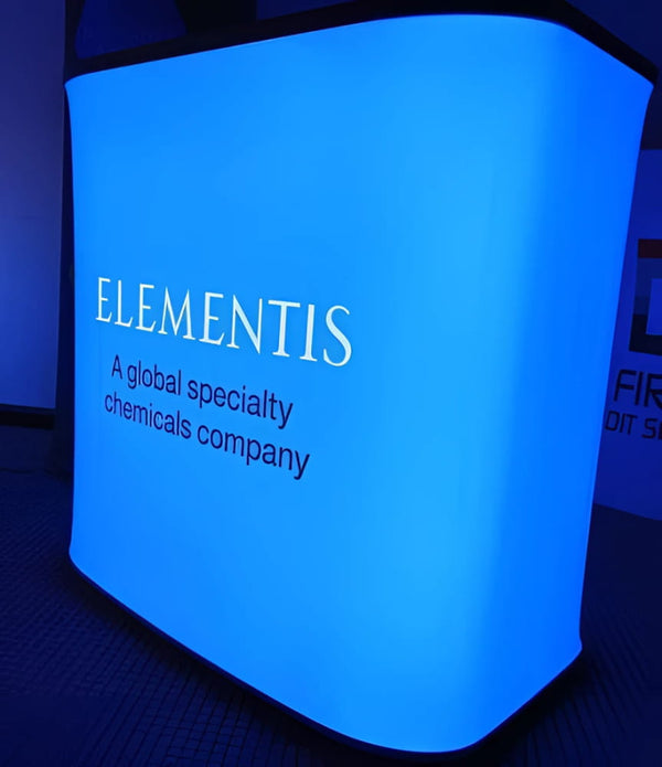 Glowing blue backlit inflatable counter display for Elementis chemicals company