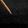 Yellow pencil on black felt of Soft Carpet Interlocking Trade Show Flooring