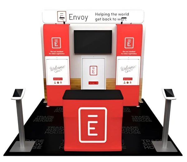 Red and white envoy trade show booth with black countertop
