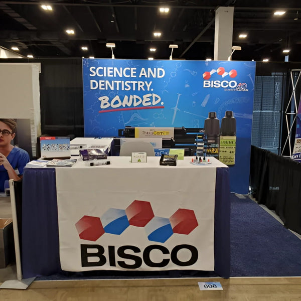 Bisco branded display table with white blue geometric banner in Table Runners