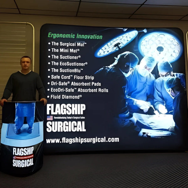 Blue illuminated flagship surgical mat on Triangle Backlit Inflatable Counter stand