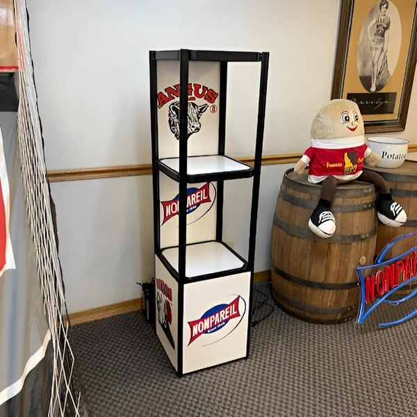 Black and white Twist-Lock 3-tier showcase with Kansas Nonpareil branding