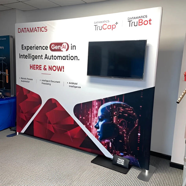 Datamatics GenAI banner on W2 TV stand with digital head graphic