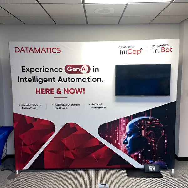 Datamatics white red GenAI banner on W2 TV stand