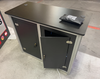 XRC7 Backlit Locking Storage Counter: black metal cabinet with silver trim, open door revealing glowing interior